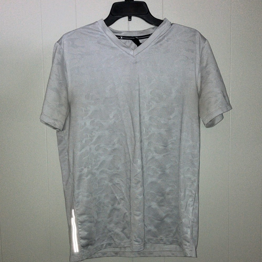 Medium sized white grey athletic v neck shirt